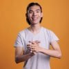 young cheerful smiling asian man applauding 2025 02 19 01 34 50 utc scaled.jpg
